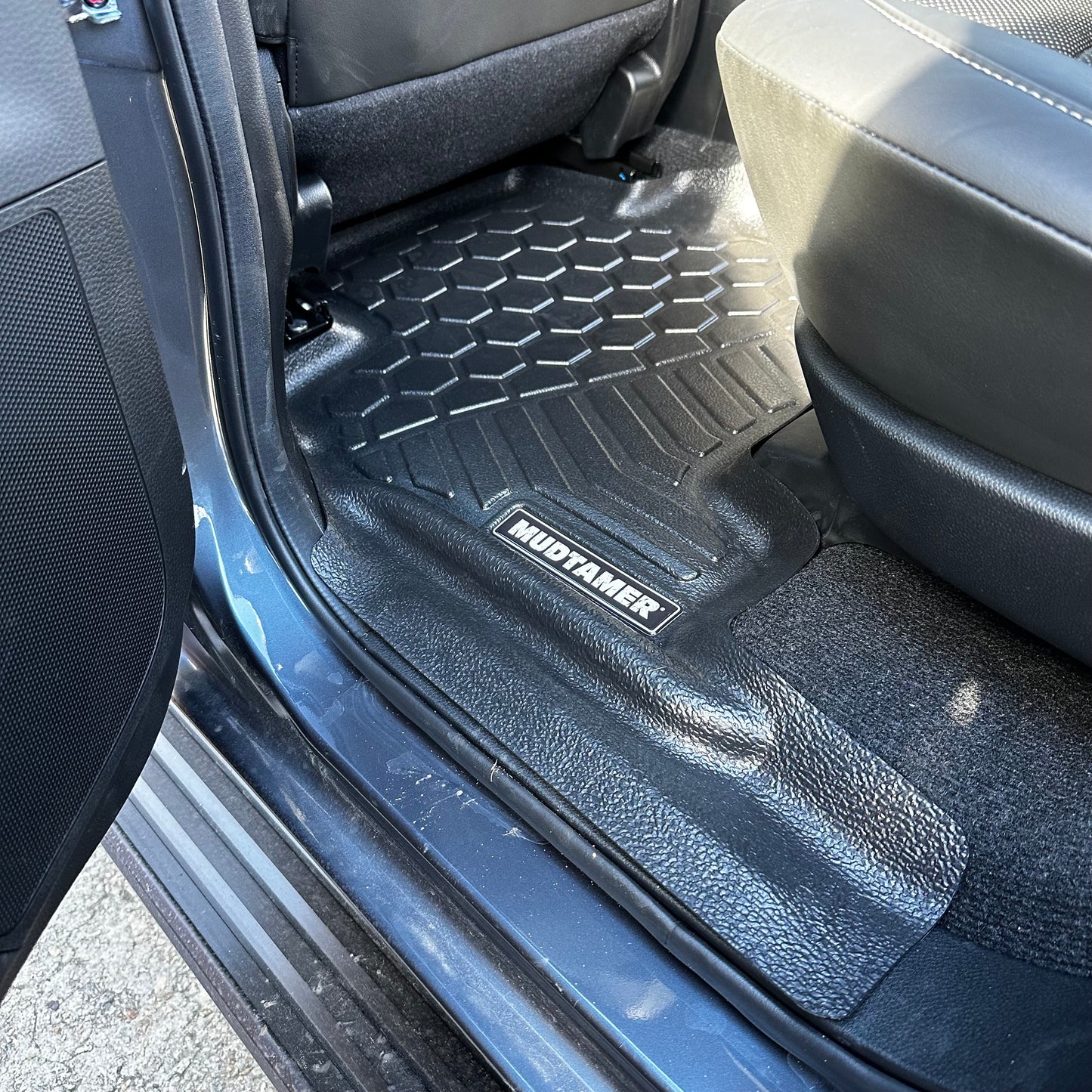 Rear MUDTAMER floor mat installed in vehicle
