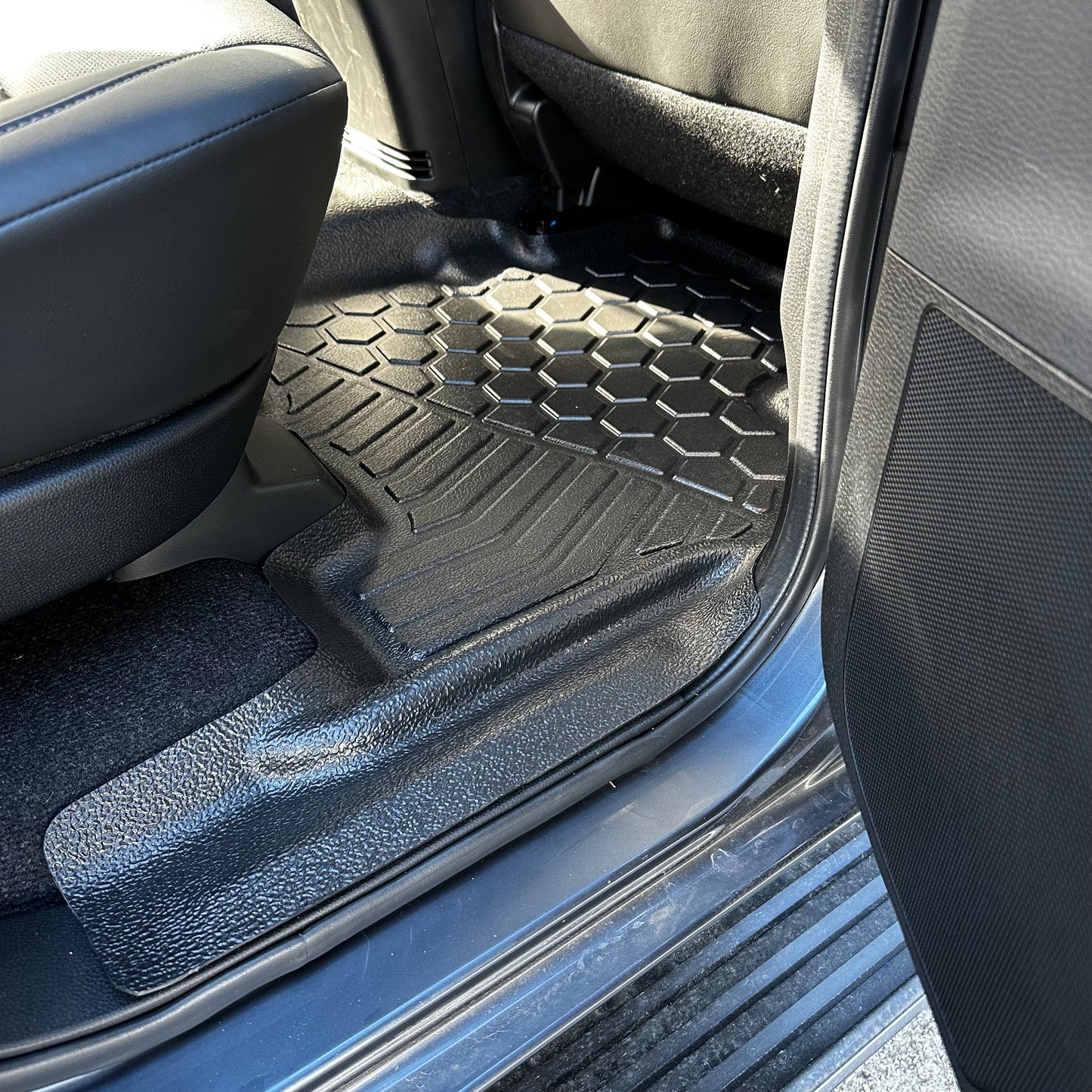 Rear MUDTAMER floor mat installed in an Isuzu MUX