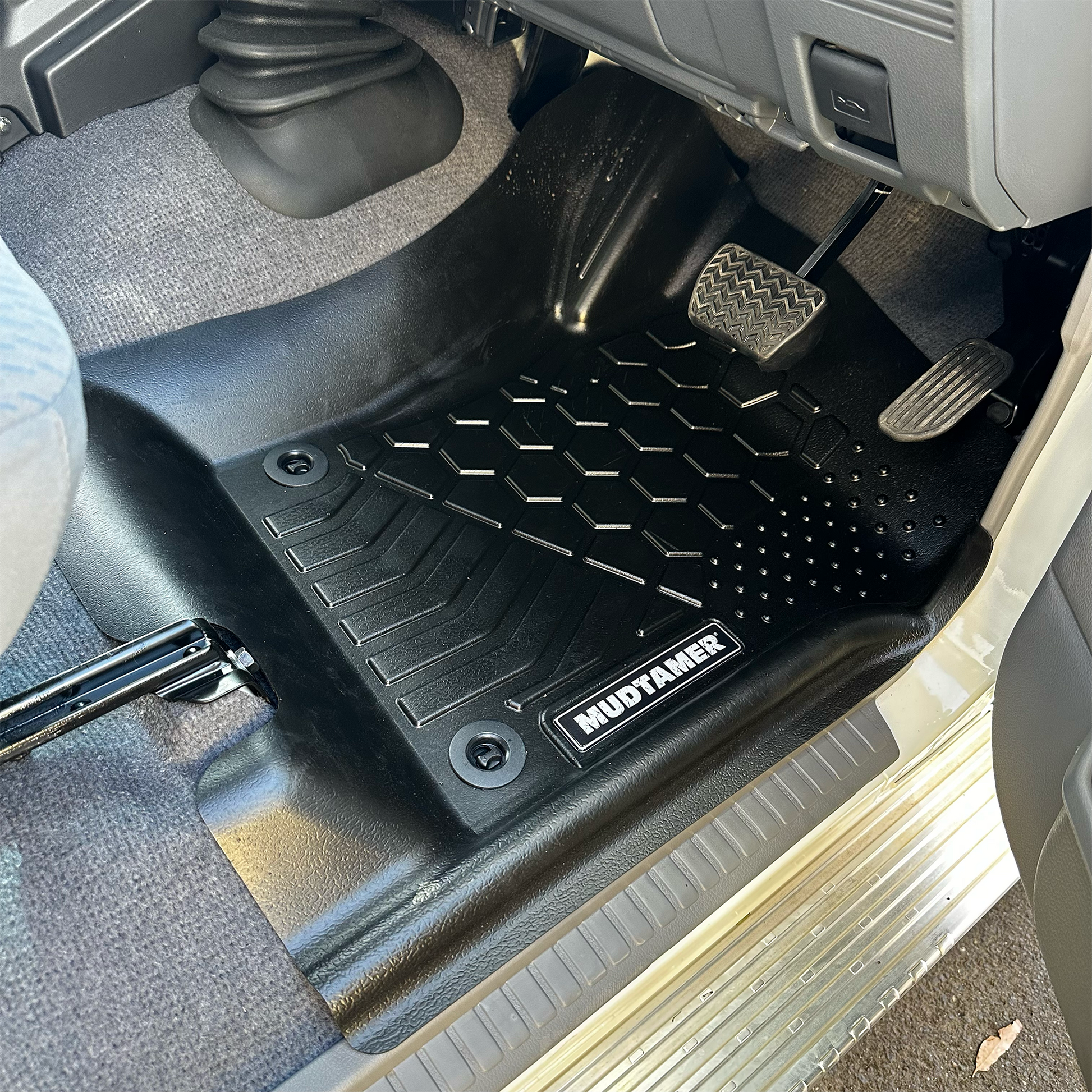 MUDTAMER front driver's side mat installed in a Toyota Landcruiser 79 Series Dual Cab