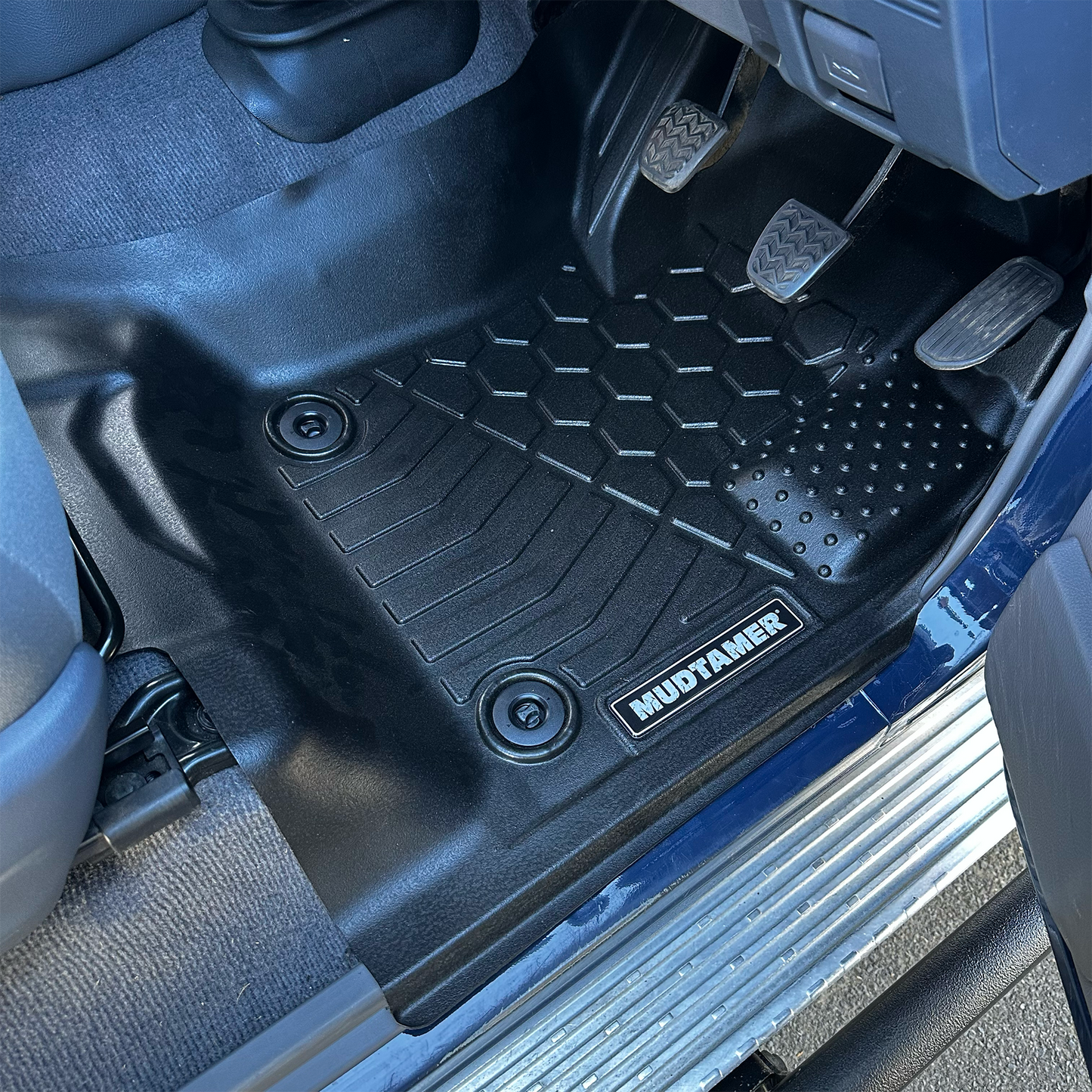 MUDTAMER driver's side floor mat installed in a Toyota Landcruiser 79 Series Single Cab